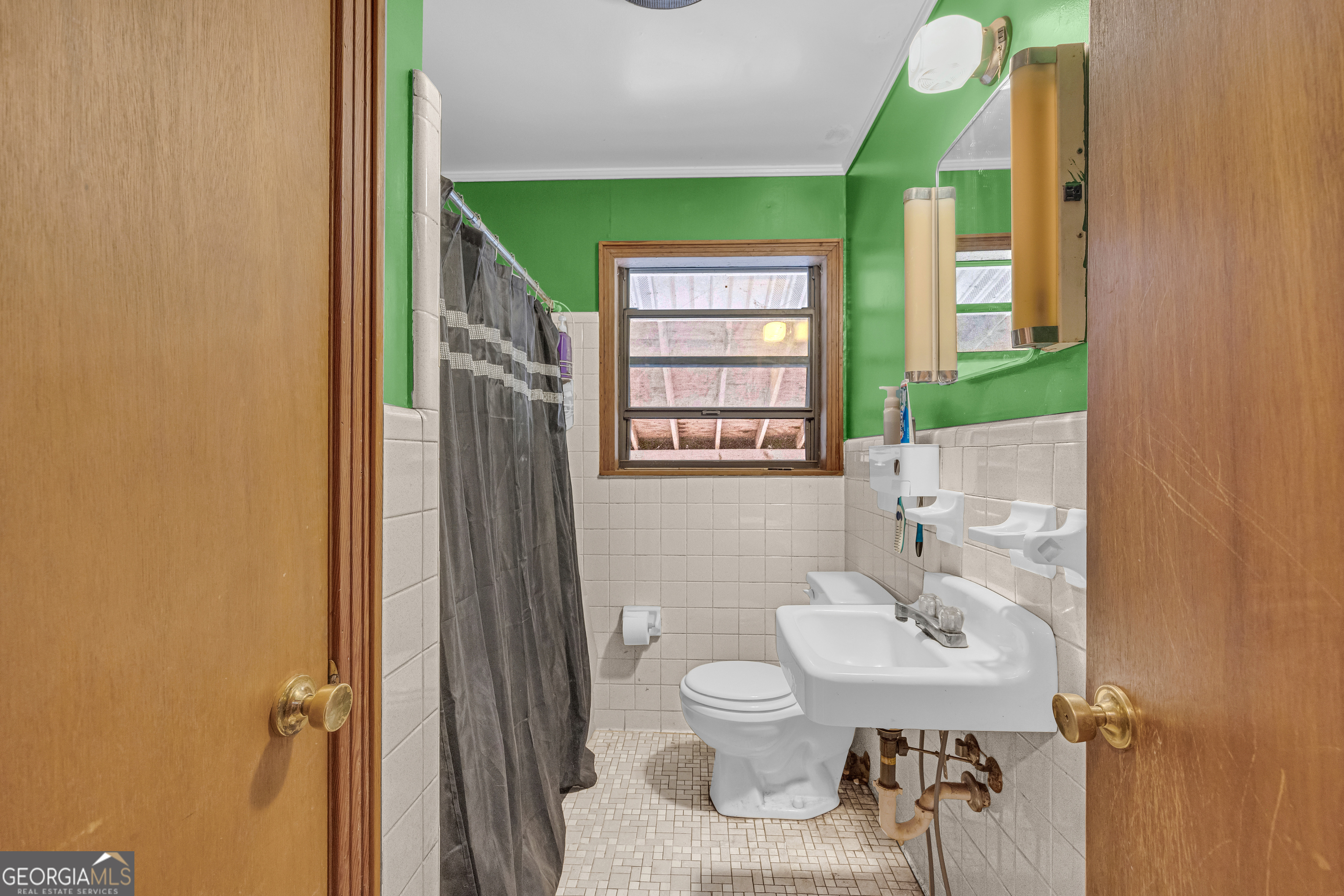 787 Parham Town Road Bowman, GA 30624 - Photo 30 of 49 a bathroom with a sink toilet and a mirror