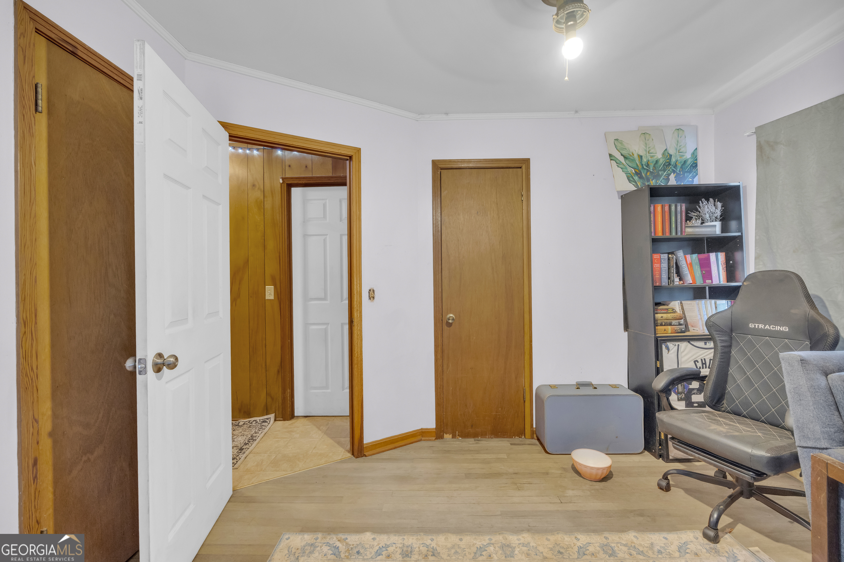787 Parham Town Road Bowman, GA 30624 - Photo 33 of 49 a view of a bedroom with workspace and a window