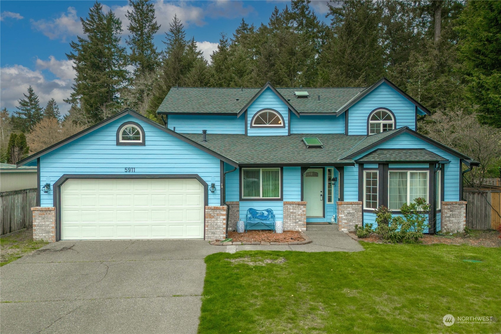 5911 Compton Loop Southeast Lacey, WA 98513 - Photo 1 of 32 a front view of a house with a yard