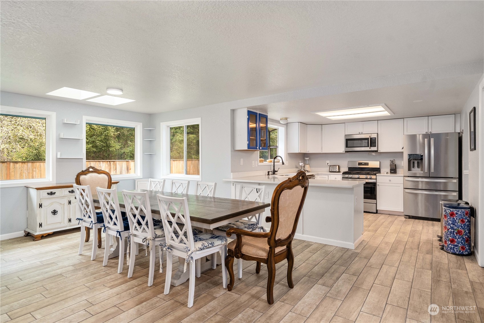 5911 Compton Loop Southeast Lacey, WA 98513 - Photo 11 of 32 a view of a dining room with furniture and wooden floor