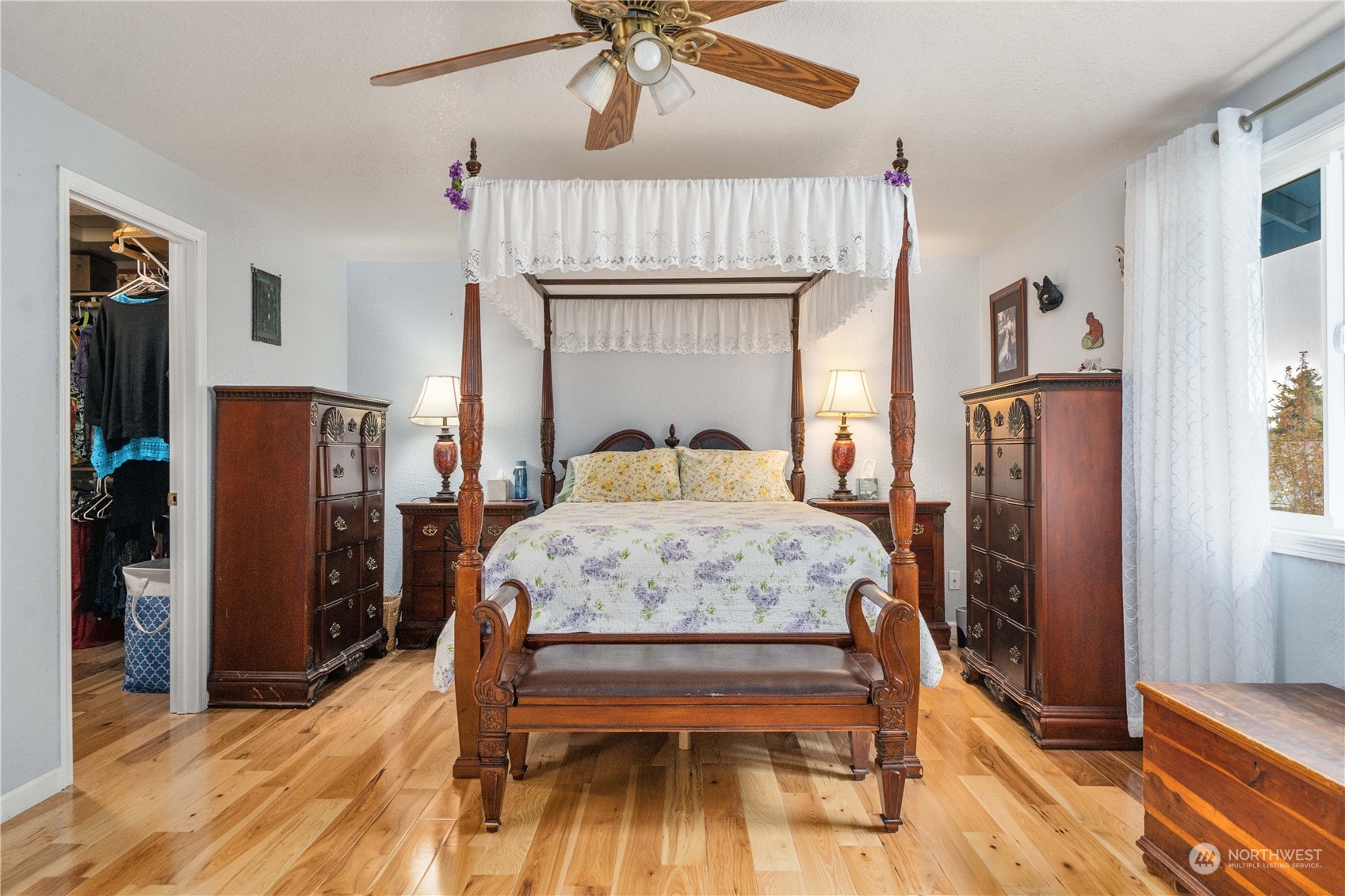 5911 Compton Loop Southeast Lacey, WA 98513 - Photo 19 of 32 a bedroom with a bed and a chandelier