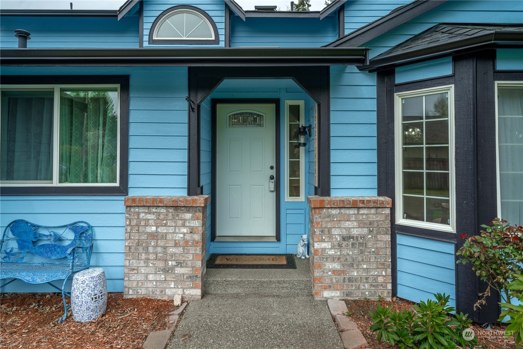 5911 Compton Loop Southeast Lacey, WA 98513 - Photo 2 of 32 a front view of a house with garden
