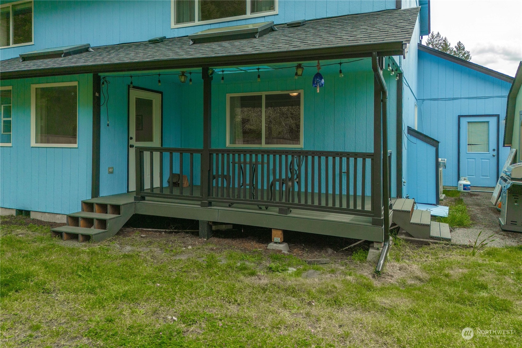 5911 Compton Loop Southeast Lacey, WA 98513 - Photo 29 of 32 a view of a house with a yard and sitting area