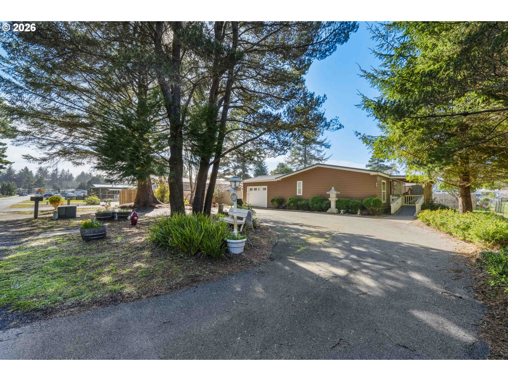 1030 June Avenue Southeast Bandon, OR 97411 - Photo 1 of 43 a view of a outdoor space with a house