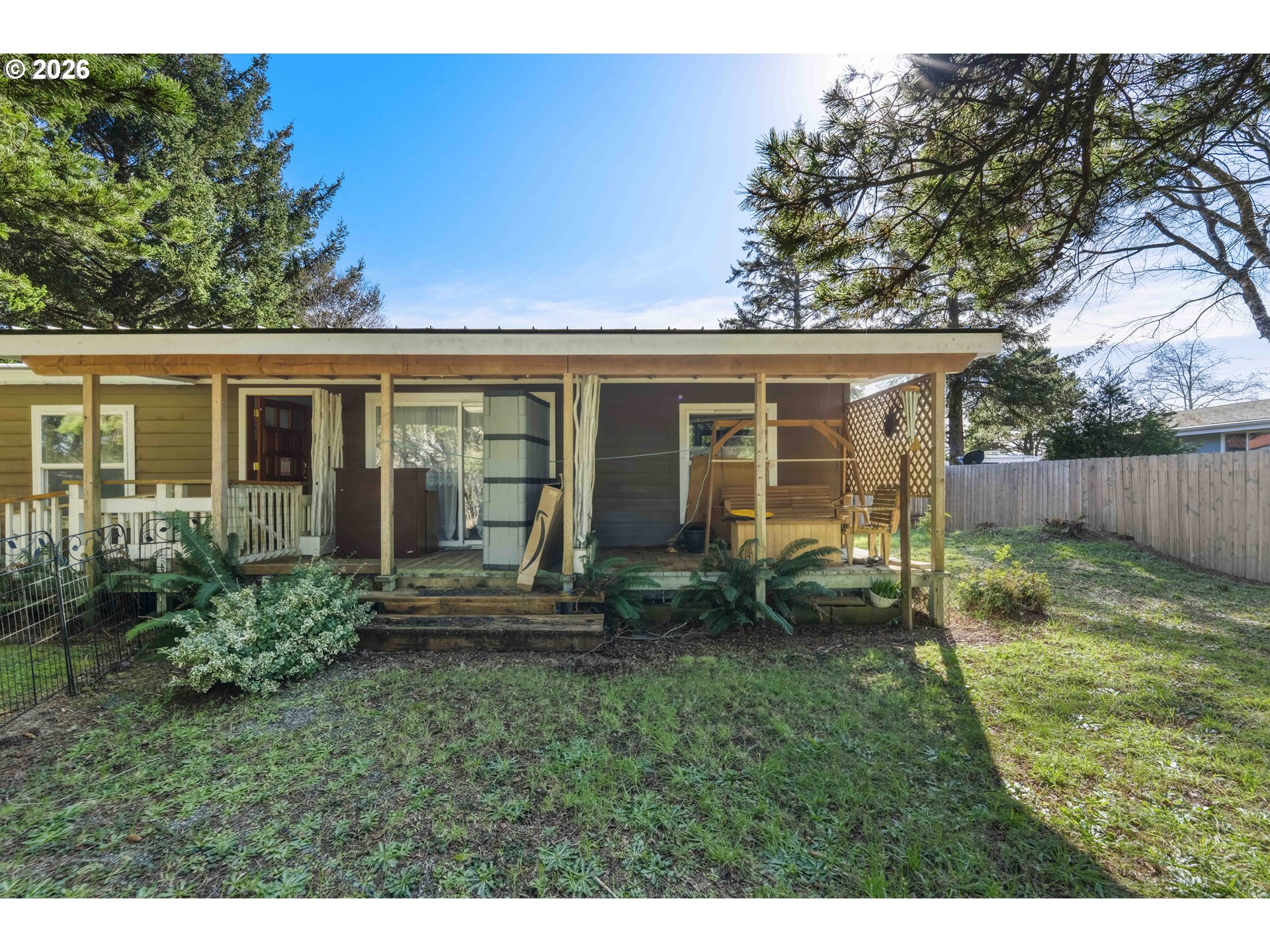 1030 June Avenue Southeast Bandon, OR 97411 - Photo 23 of 43 a view of house with backyard