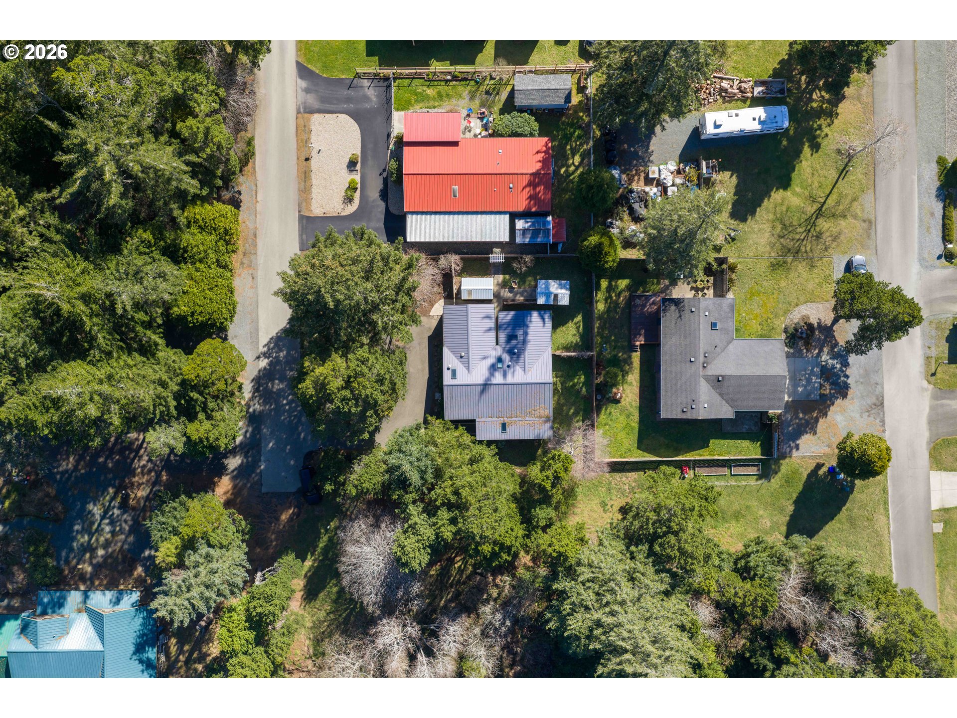 1030 June Avenue Southeast Bandon, OR 97411 - Photo 42 of 43 an aerial view of a house with a yard and outdoor seating