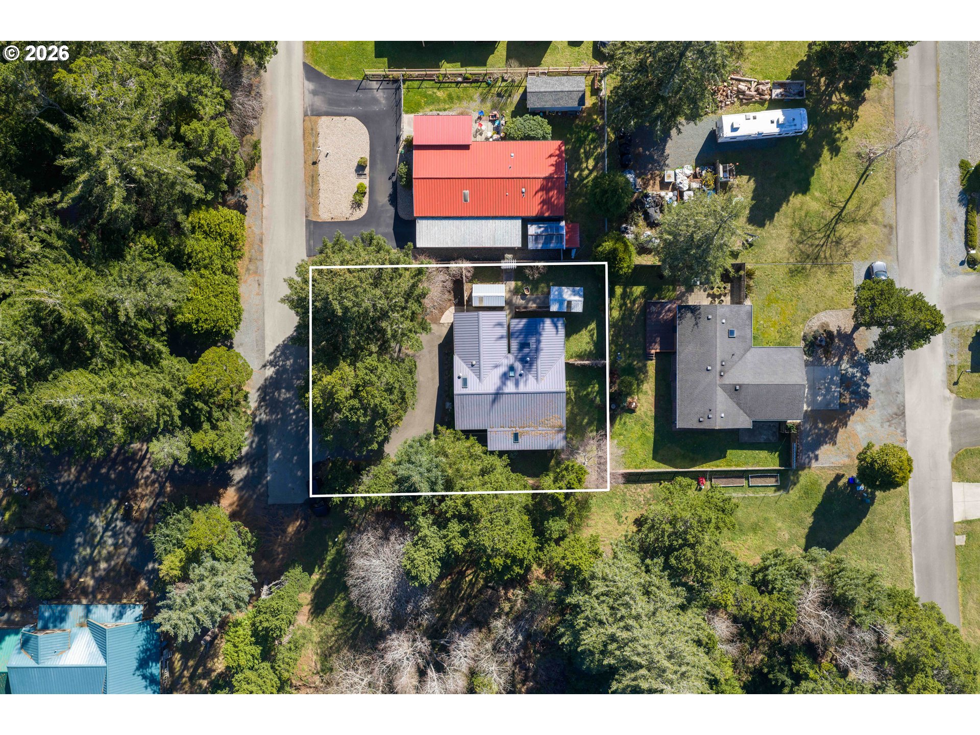 1030 June Avenue Southeast Bandon, OR 97411 - Photo 43 of 43 an aerial view of a house with a yard and garden
