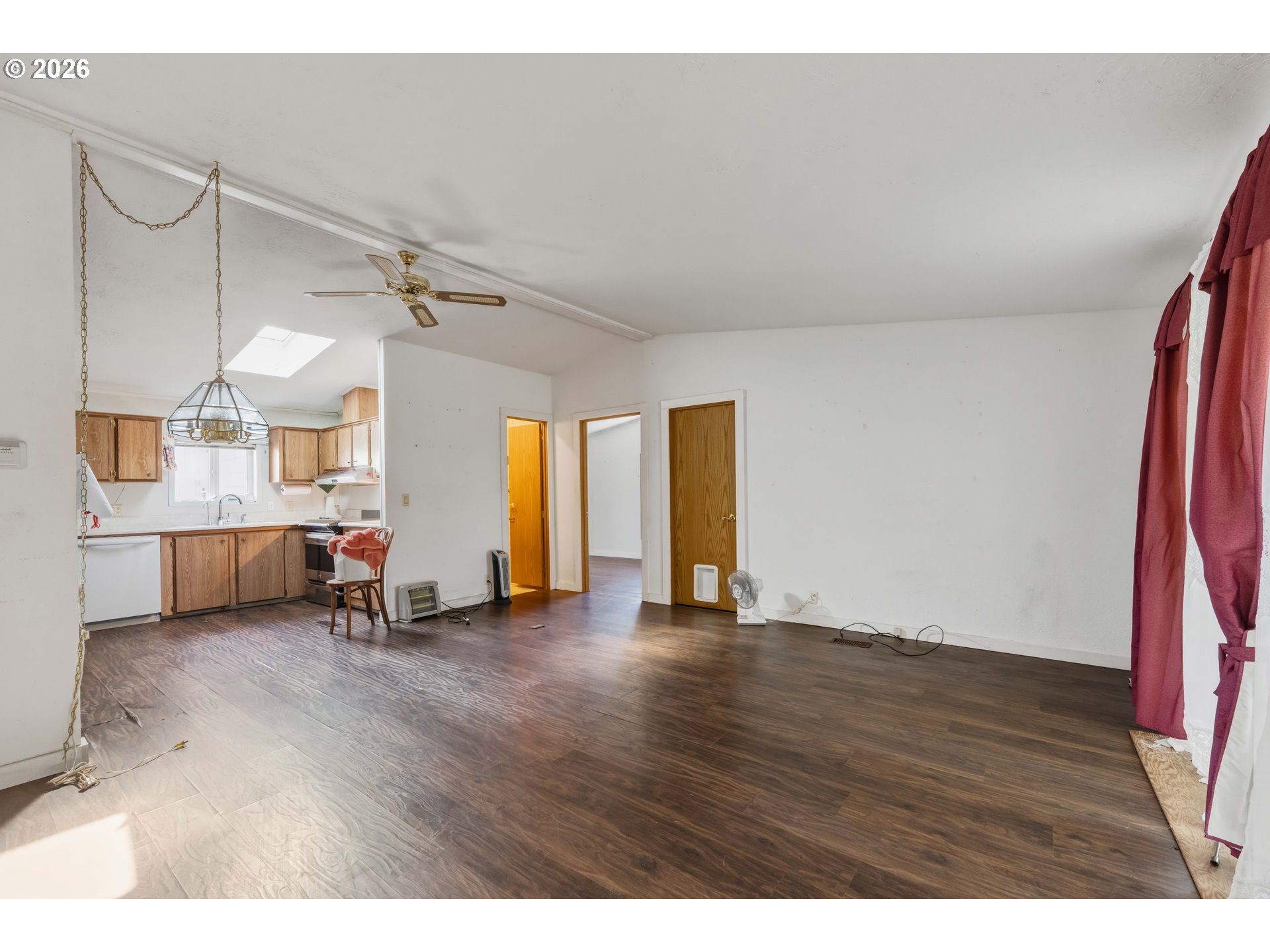 1030 June Avenue Southeast Bandon, OR 97411 - Photo 5 of 43 a view of a room with wooden floor and window