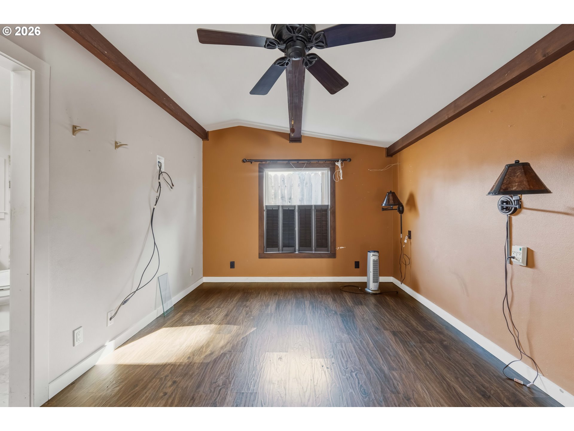1030 June Avenue Southeast Bandon, OR 97411 - Photo 10 of 43 a view of room with window and wooden floor