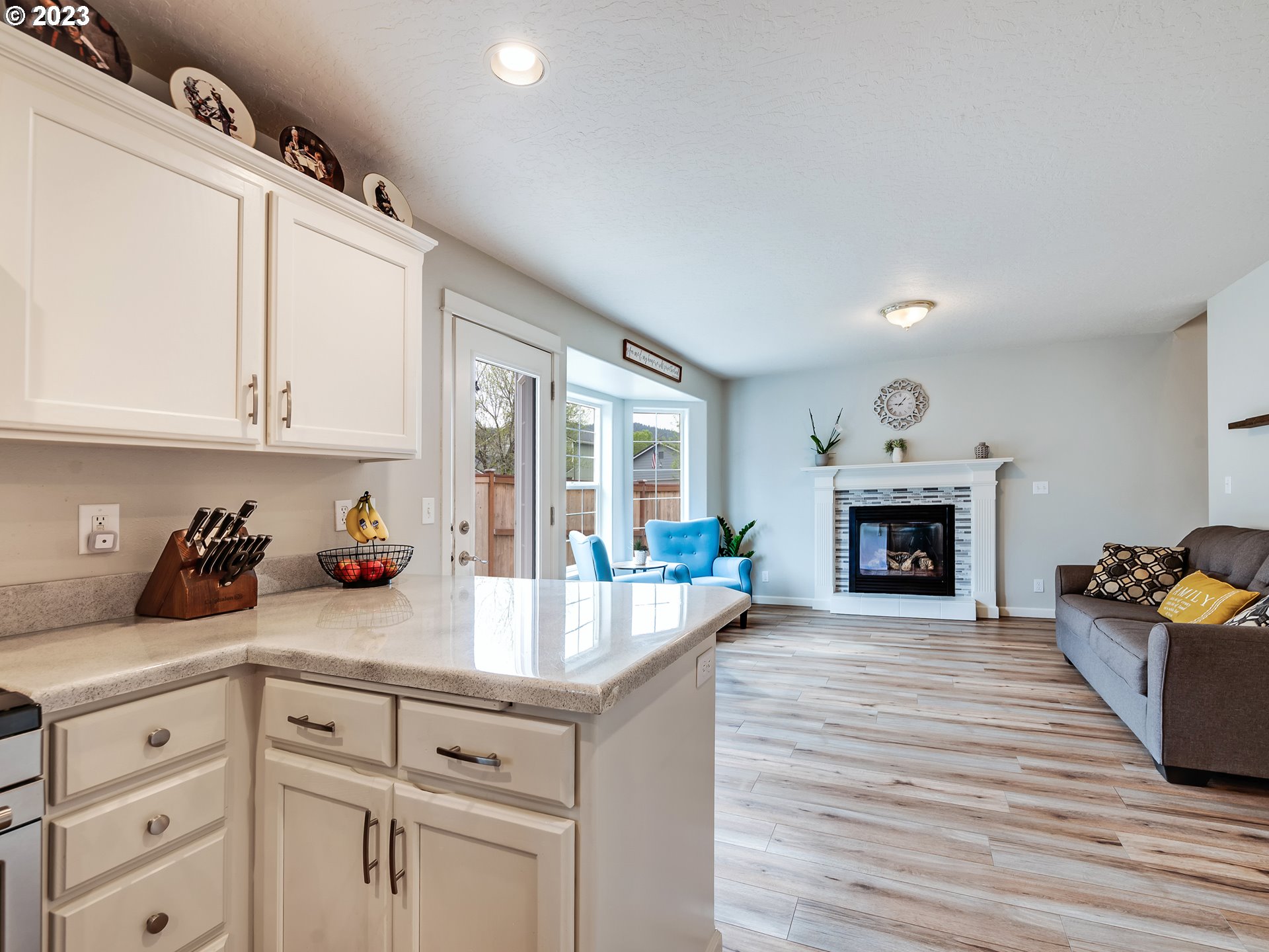 939 65th Place Springfield, OR 97478 - Photo 8 of 36 a kitchen with sink cabinets and fireplace