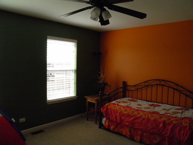 3090 Patterson Road Montgomery, IL 60538 - Photo 12 of 14 a bedroom with a bed next to a window