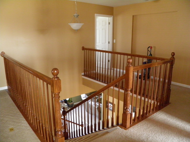 3090 Patterson Road Montgomery, IL 60538 - Photo 6 of 14 a view of staircase with railing and a chandelier