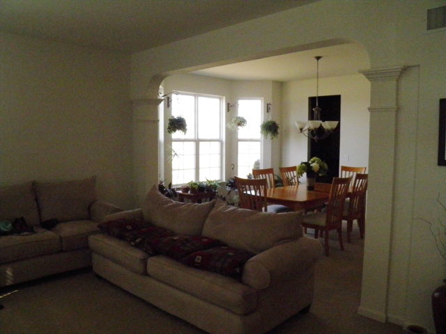 3090 Patterson Road Montgomery, IL 60538 - Photo 9 of 14 a living room with furniture and a window