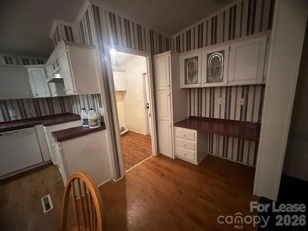 a view of an entryway with wooden floor