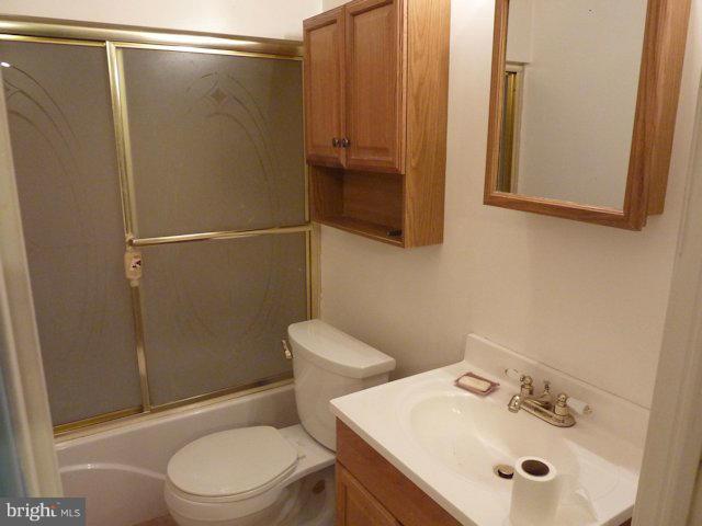 304 Miles Road Baltimore, MD 21221 - Photo 12 of 19 a bathroom with a sink a toilet and shower