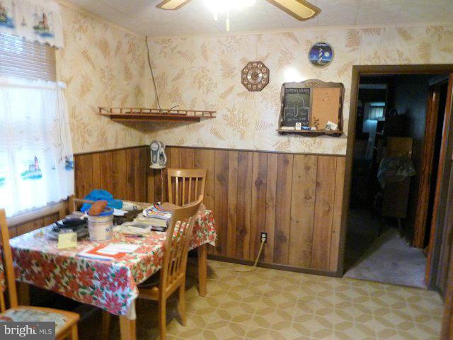 304 Miles Road Baltimore, MD 21221 - Photo 3 of 19 a view of a dining area with furniture and a rug