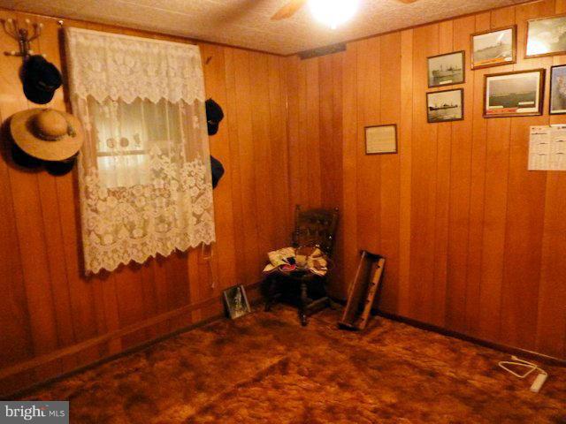 304 Miles Road Baltimore, MD 21221 - Photo 5 of 19 a bedroom with a table and a chair