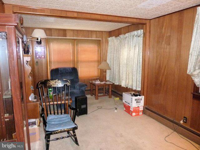 304 Miles Road Baltimore, MD 21221 - Photo 10 of 19 a view of a livingroom with furniture and a window