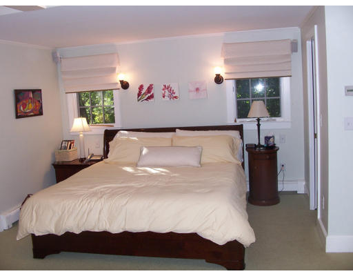 8 Squirrel Road Wellesley, MA 02481 - Photo 16 of 24 a bedroom with a bed and a large mirror