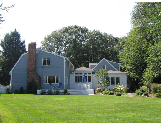 8 Squirrel Road Wellesley, MA 02481 - Photo 3 of 24 a front view of a house with a garden