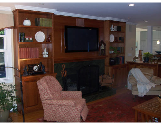 8 Squirrel Road Wellesley, MA 02481 - Photo 8 of 24 a living room with furniture a fireplace and a flat screen tv