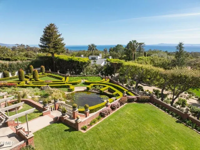 an aerial view of a house with a swimming pool