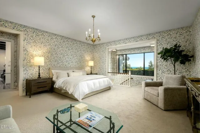 a bedroom with a bed and a fireplace