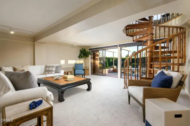 a bedroom with a bed and a chair