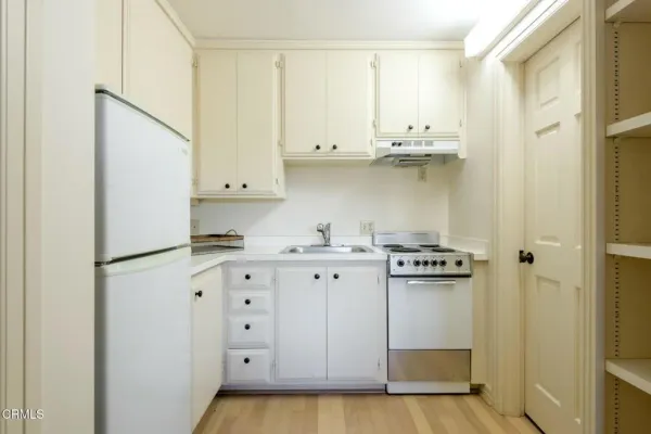 a spacious bathroom with a double vanity sink and a mirror