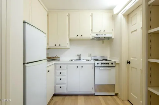 a spacious bathroom with a double vanity sink and a mirror
