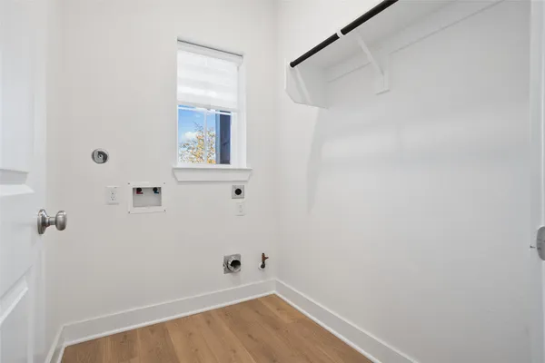 a view of small space with wooden floor and windows