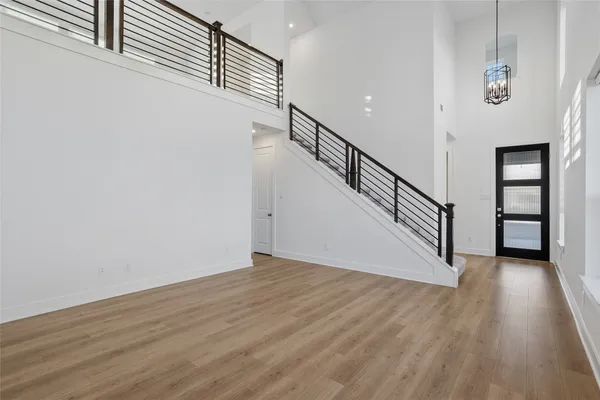 a view of an entryway with wooden floor