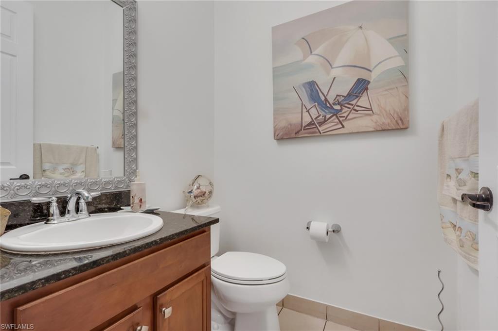 5289 Beckton Road Immokalee, FL 34142 - Photo 12 of 37 a bathroom with a granite countertop sink and a toilet