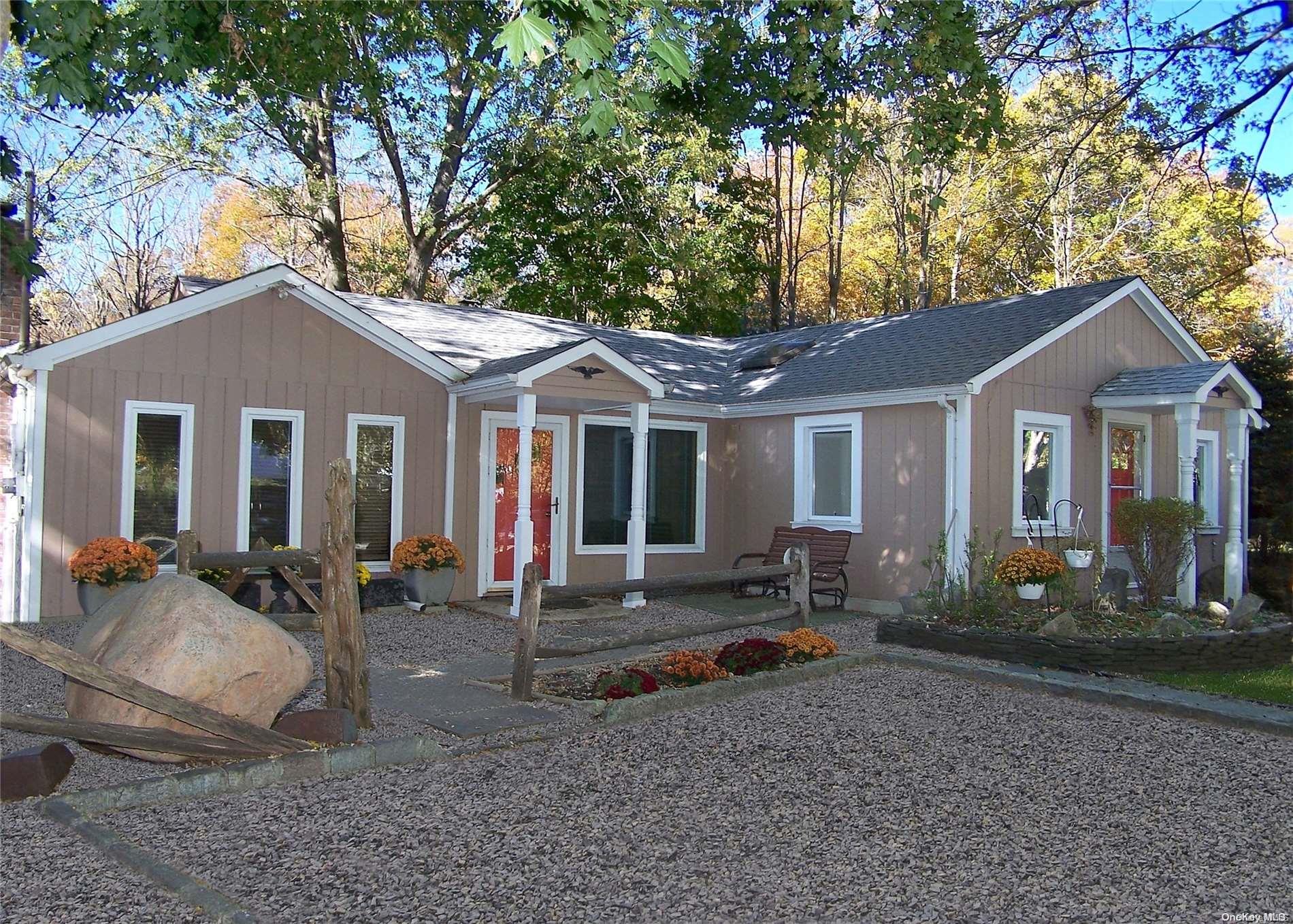 9 Old Middle Country Road Middle Island, NY 11953 - Photo 1 of 1 a front view of a house with outdoor seating