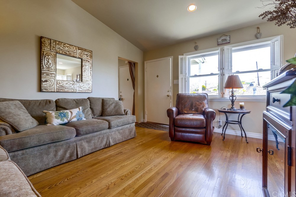 308 Encino Lane San Clemente, CA 92672 - Photo 5 of 22 Living room unit A wood floors, vinyl windows w shutters