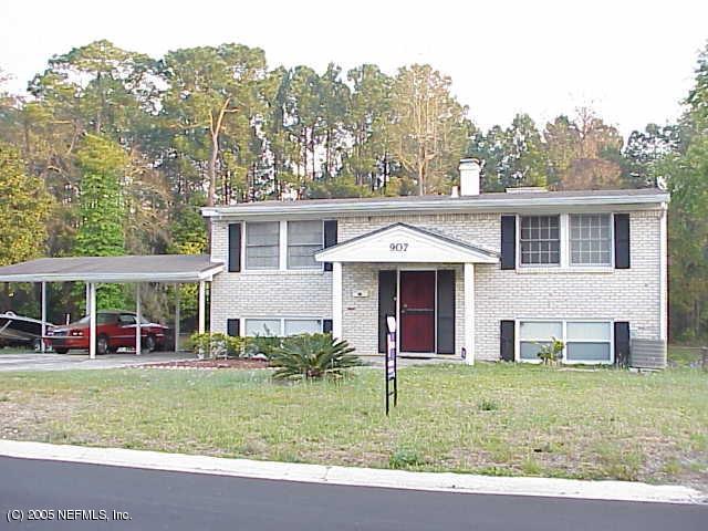 907 Bacall Road Jacksonville, FL 32218 - Photo 1 of 1 front view of a house with a yard