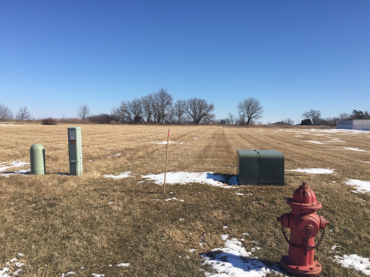 Tbd Pleasant Street DeKalb, IL 60115 - Photo 5 of 6 a view of a lake with lawn chairs and large trees