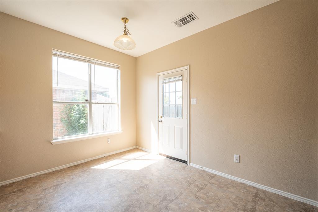 447 Maple Grove Drive Cedar Hill, TX 75104 - Photo 6 of 15 a view of an empty room with a window