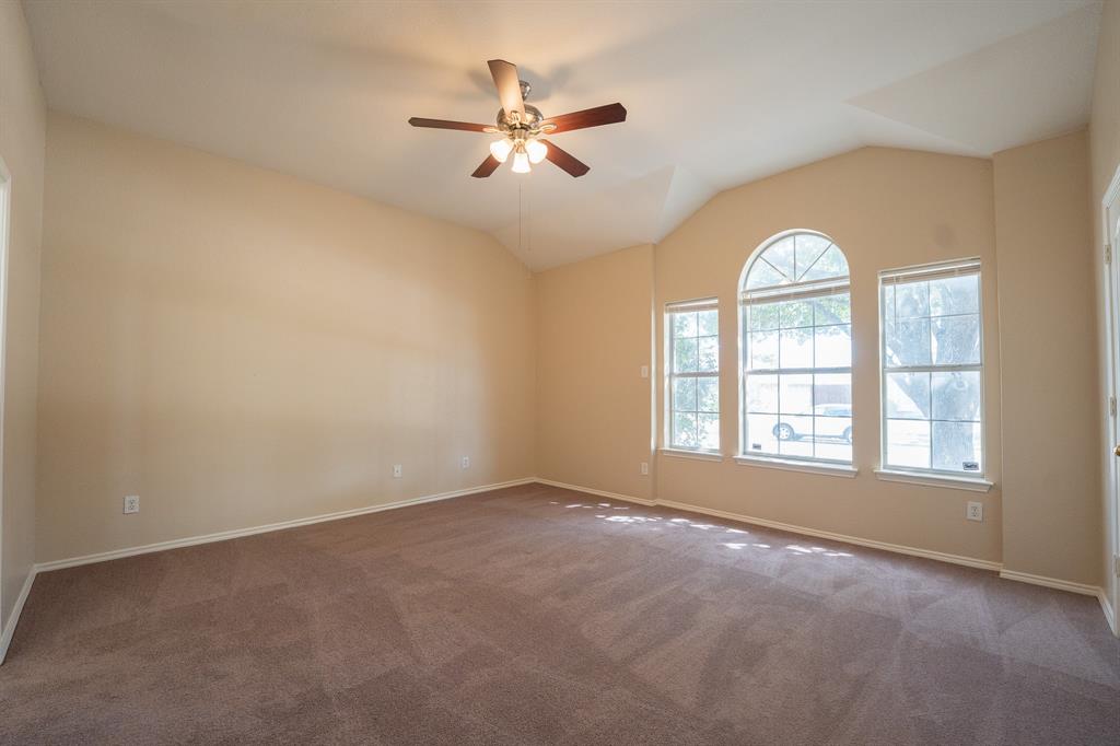 447 Maple Grove Drive Cedar Hill, TX 75104 - Photo 9 of 15 an empty room with chandelier fan and windows