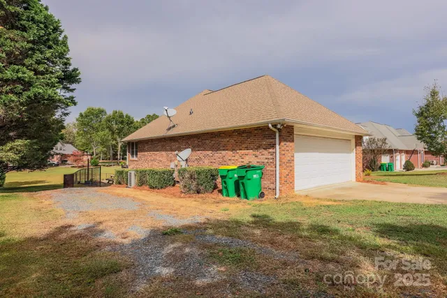 a view of a house with a yard and garage