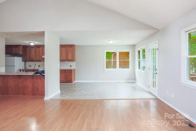 a view of a kitchen with a sink and a window