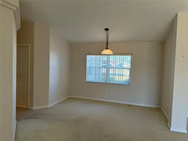 a view of empty room with windows