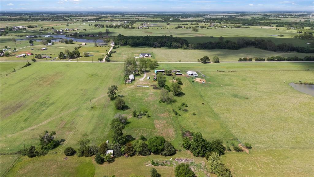 11742 Dane Road Pilot Point, TX 76258 - Photo 19 of 37 a view of a lake with a houses