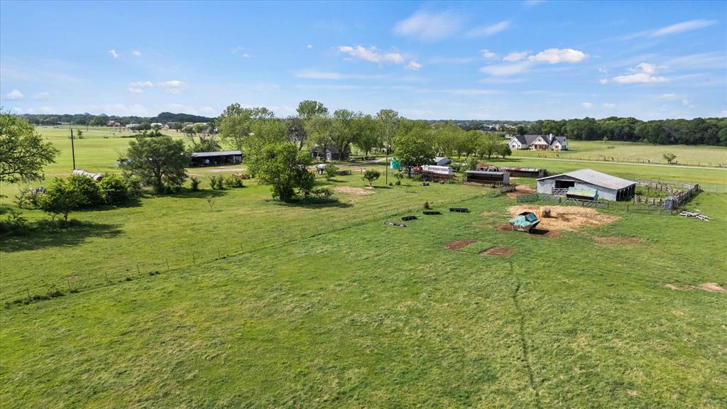 11742 Dane Road Pilot Point, TX 76258 - Photo 2 of 37 a childrens park with lots of swings and slides