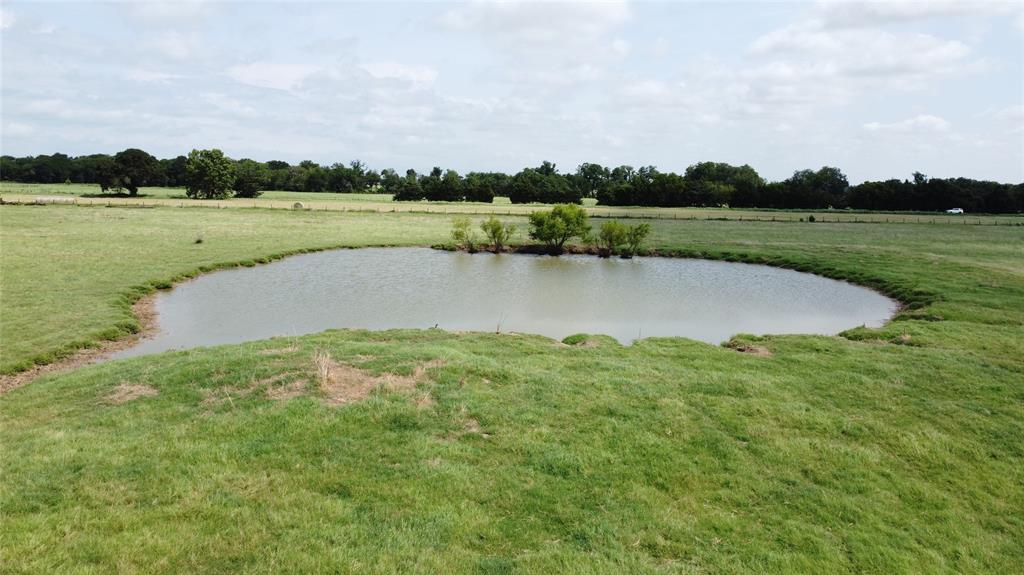 11742 Dane Road Pilot Point, TX 76258 - Photo 3 of 37 a view of a lake with a big yard