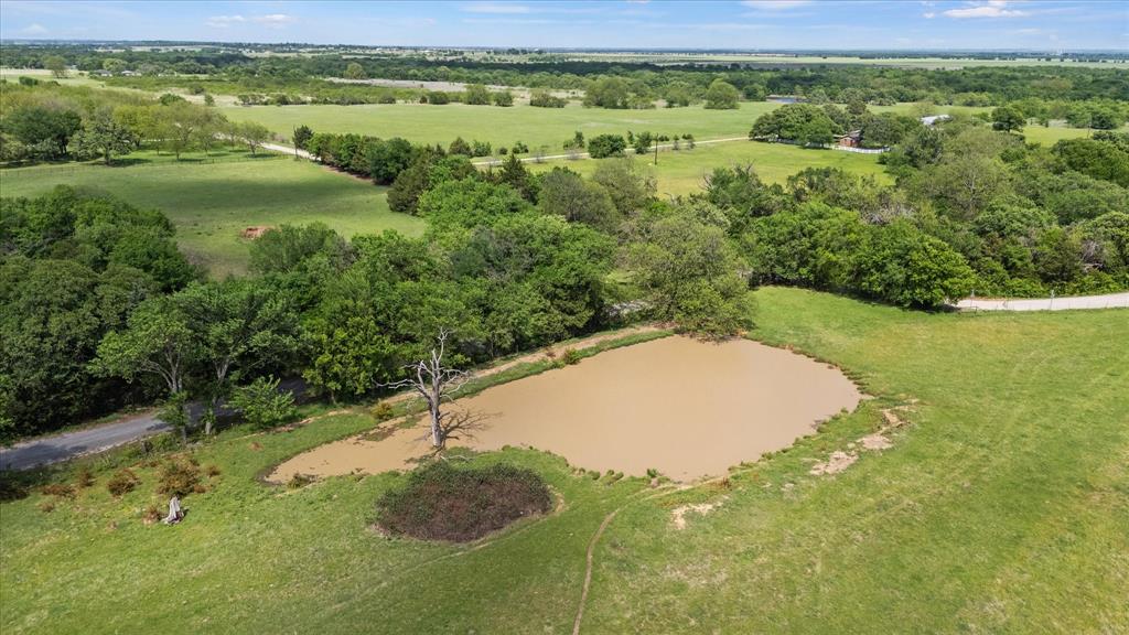 11742 Dane Road Pilot Point, TX 76258 - Photo 35 of 37 a view of a field with an ocean view