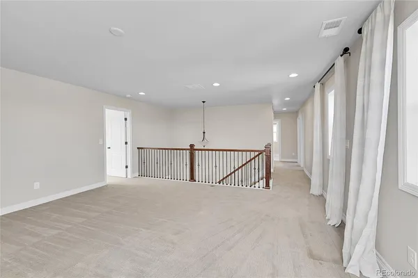 a view of staircase with wooden floor and windows