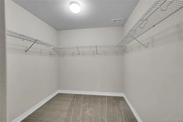 a view of a room with racks on the wall