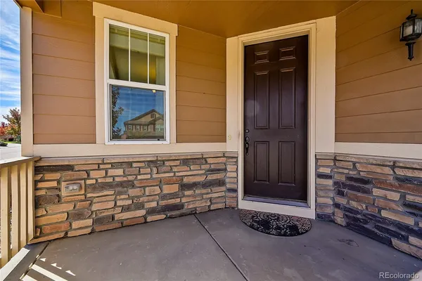 a view of a wooden door and a window