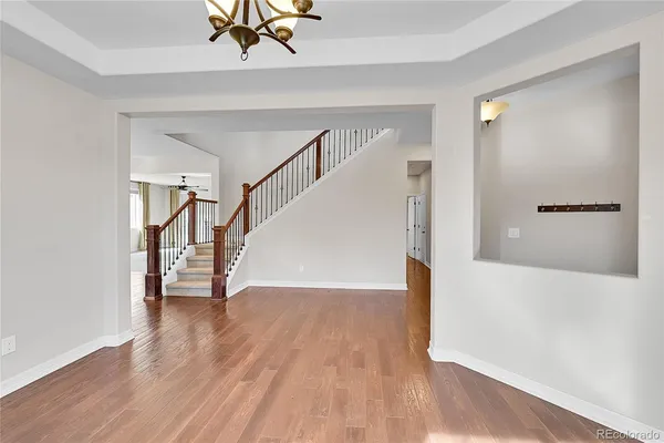 a view of an entryway with wooden floor